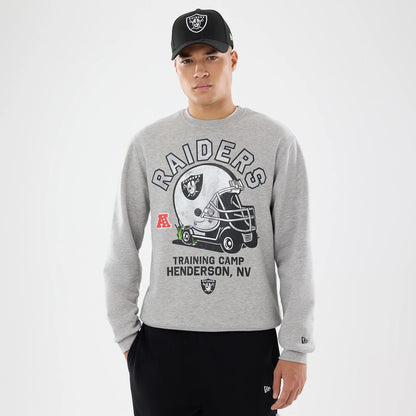 The model is wearing this NFL Training 2026 Las Vegas Raiders Crew Neck Sweater in grey. 1