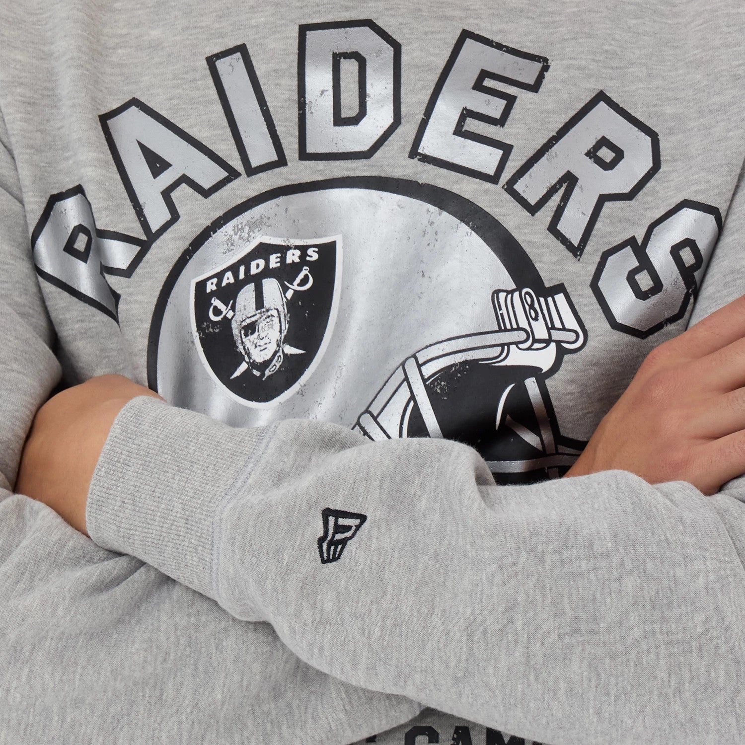 The model is wearing this NFL Training 2026 Las Vegas Raiders Crew Neck Sweater in grey. 3