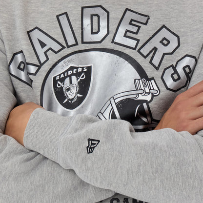 The model is wearing this NFL Training 2026 Las Vegas Raiders Crew Neck Sweater in grey. 3
