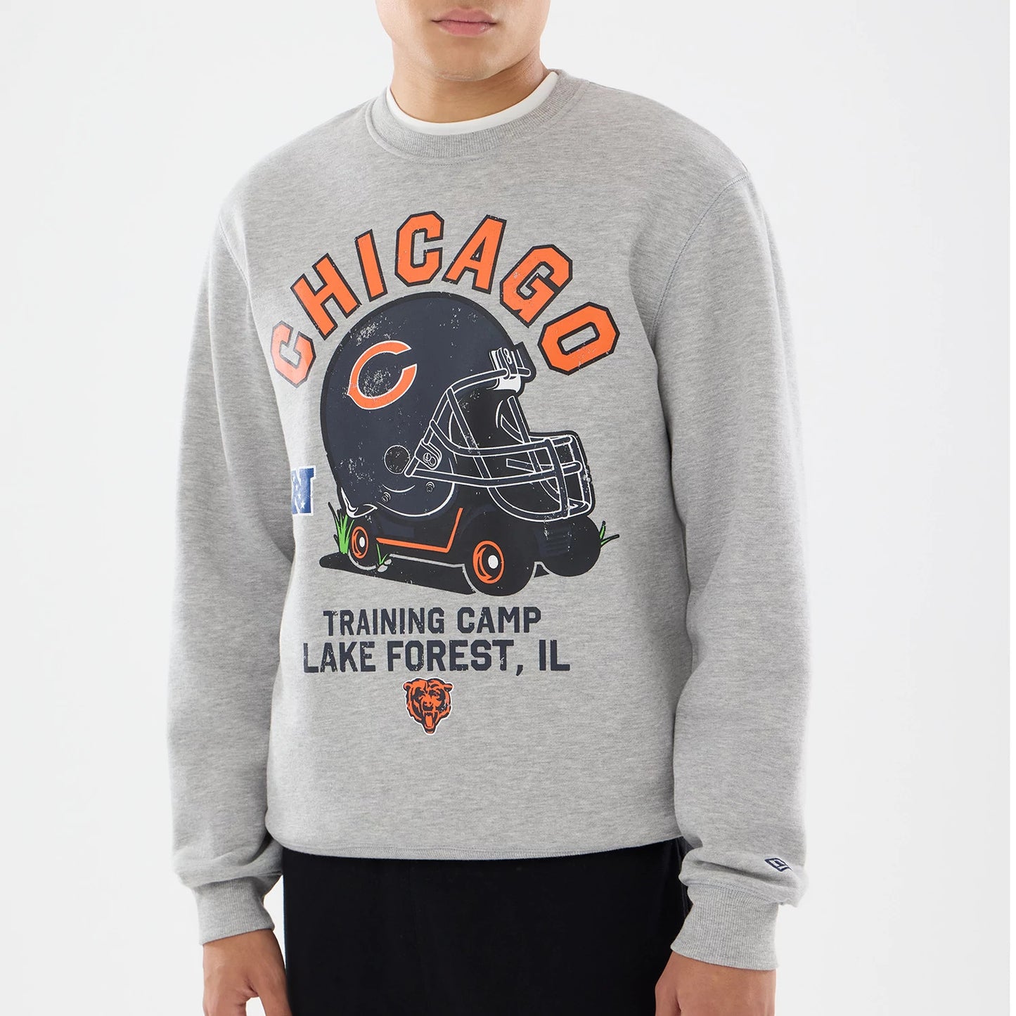 The model is wearing this NFL Training 2026 Chicago Bears Crew Neck Sweater in grey. 3