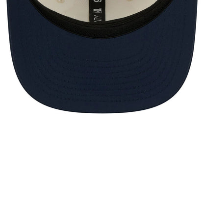 Patriots NFL Training 2026 White New Era 9SEVENTY Stretch Snap Adjustable Cap, inside view showing the black sweatband and black taping with white text running along the crown, and a navy blue undervisor beneath the structured panels.