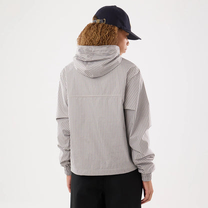 The model is wearing this Womens New Era Check Oversized Windbreaker Jacket in beige. 2