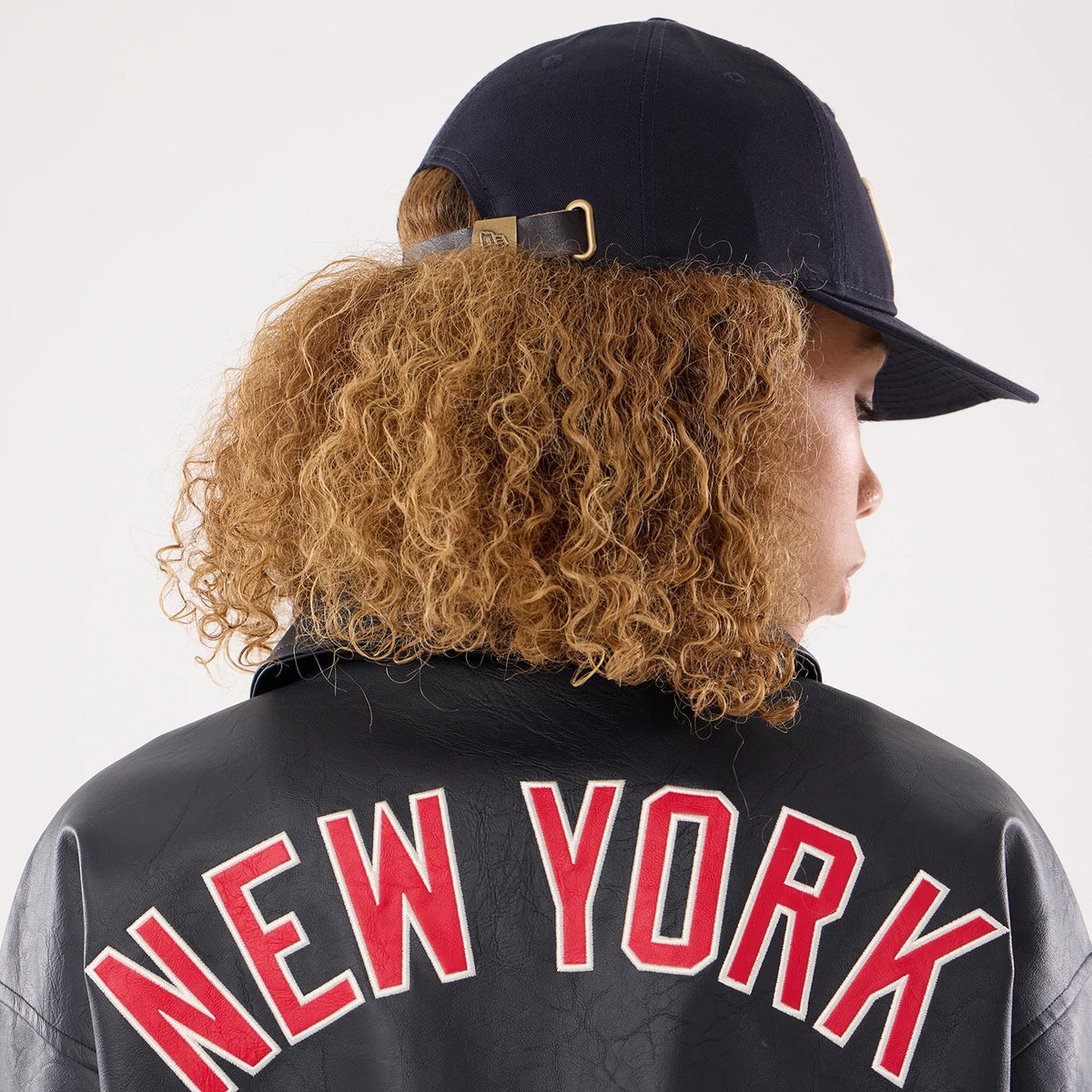 The model is wearing this Womens MLB New York Yankees Collared Jacket in navy. 7