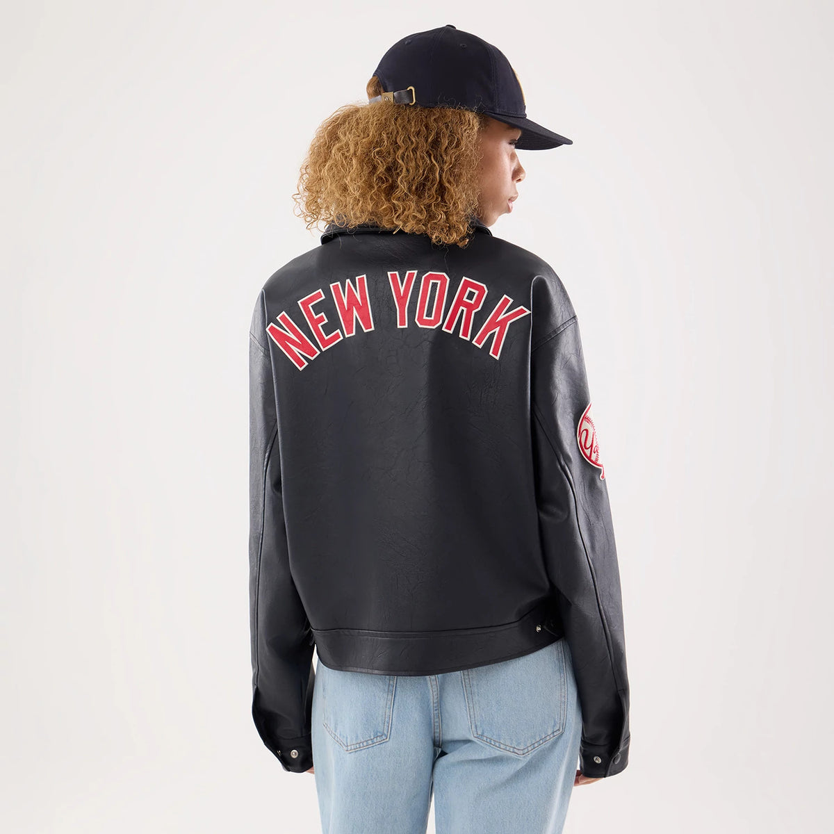The model is wearing this Womens MLB New York Yankees Collared Jacket in black. 2