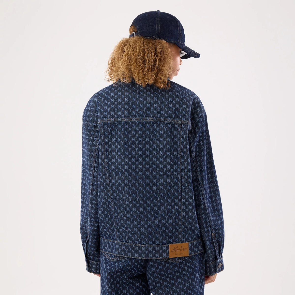 The model is wearing this Womens MLB Denim New York Yankees Jacket in navy. 2