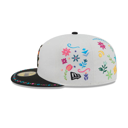 Chicago White Sox MLB Heritage Light Beige New Era 59FIFTY Fitted Cap, side view showing colourful floral embroidery across the light beige crown, a black flat visor with multicoloured edge accents, and the New Era flag logo on the left side.