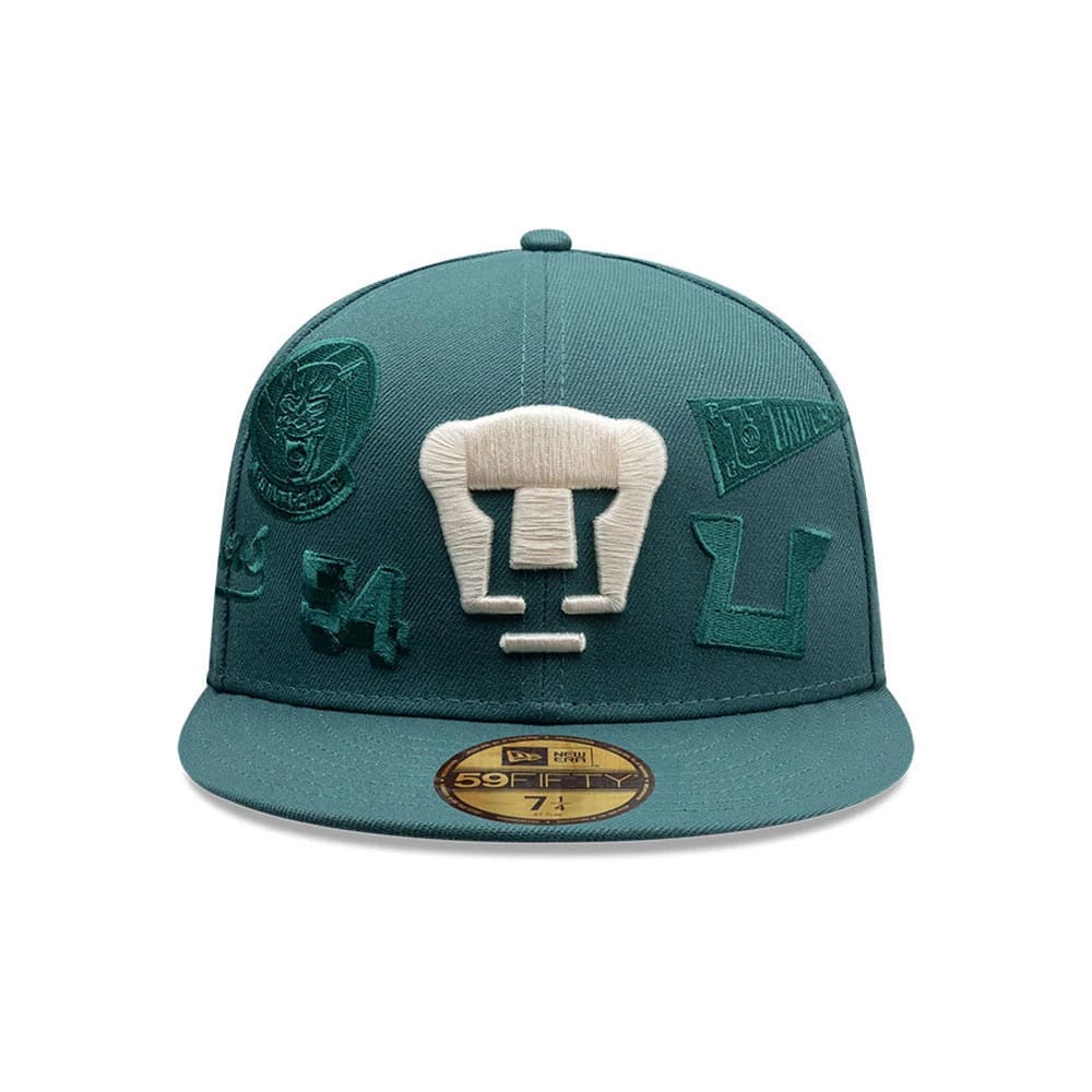 Pictured is this Liga MX All Over Pumas Unam 59FIFTY Fitted cap in dark green. 2