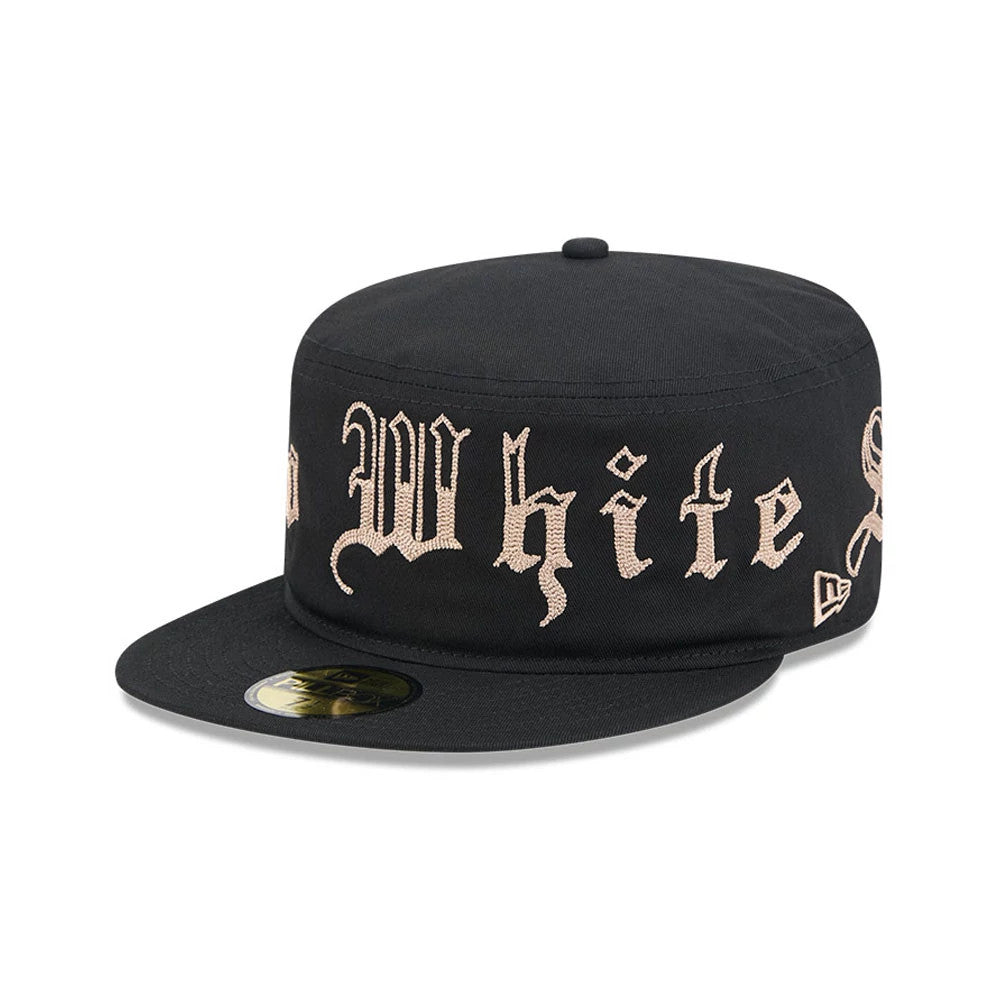 Chicago White Sox MLB Heritage Black New Era Pillbox Cap, three-quarter view showing cream embroidered lettering across the structured black crown, a flat black visor with a gold 59FIFTY size sticker, and the New Era flag logo on the left side.