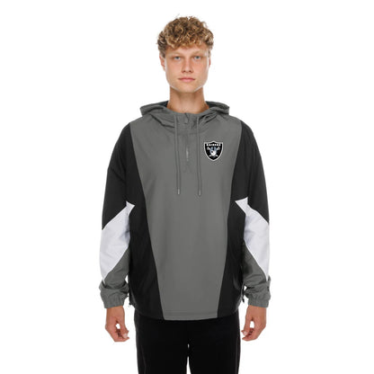 The model is wearing this NFL Las Vegas Raiders Windbreaker Jacket in grey. 1