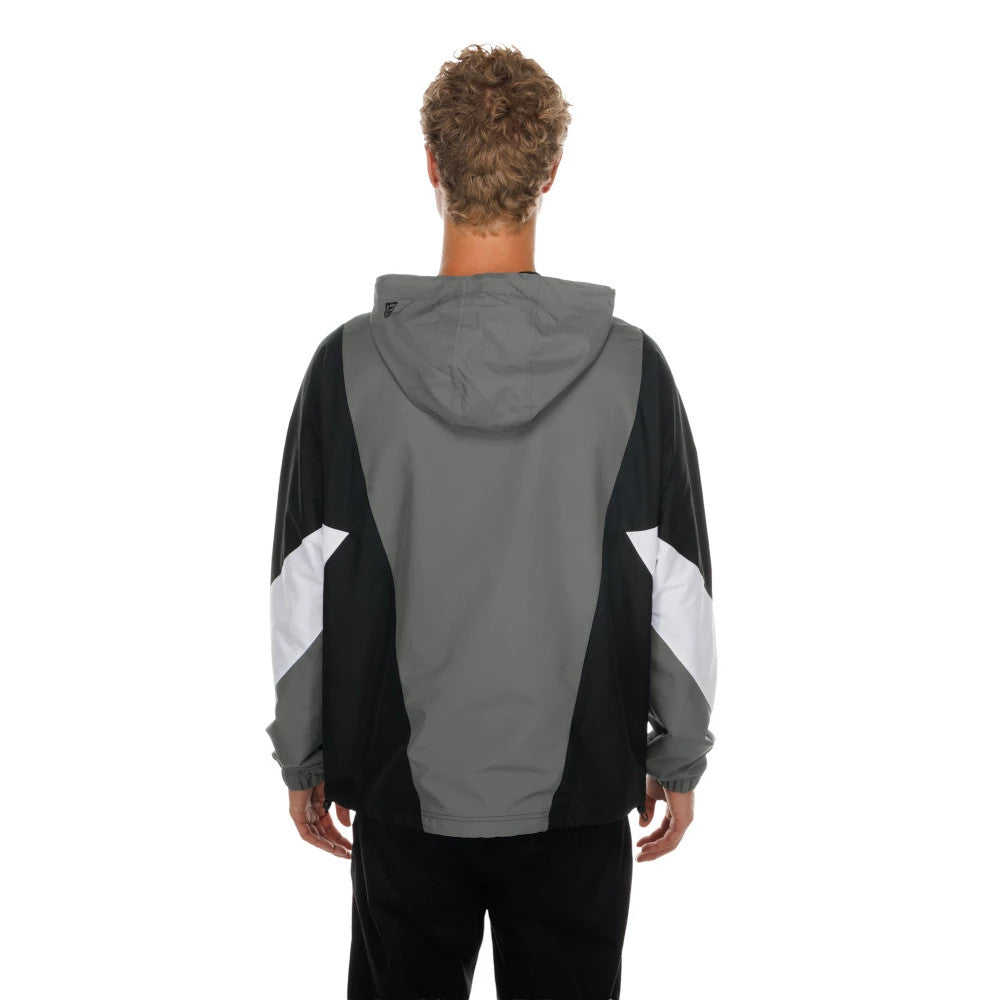 The model is wearing this NFL Las Vegas Raiders Windbreaker Jacket in grey. 2
