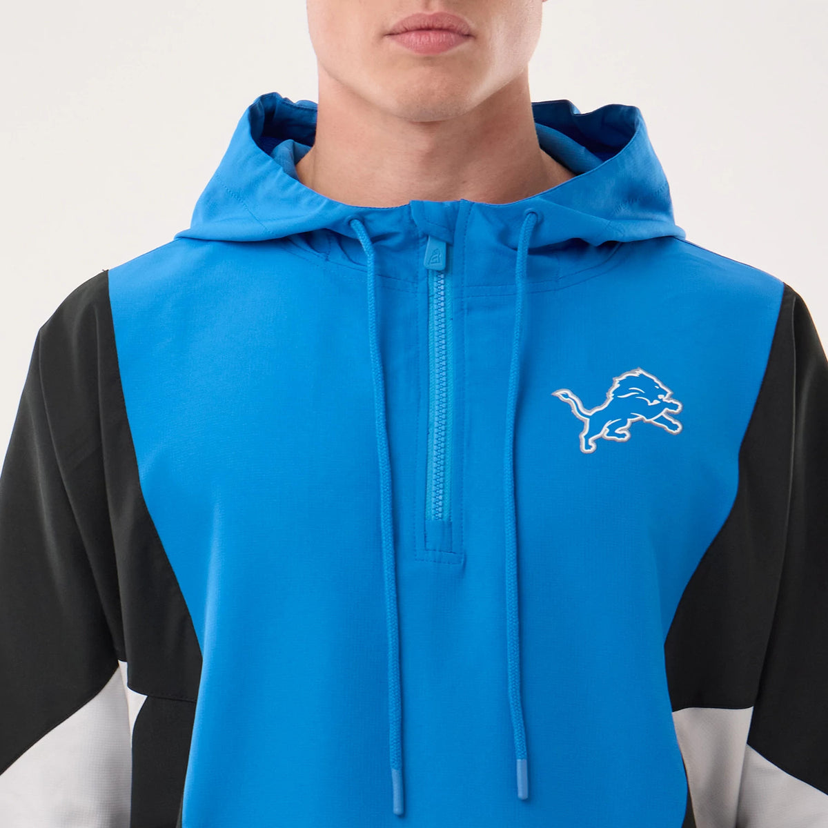The model is wearing this NFL Detroit Lions Jacket in blue. 4