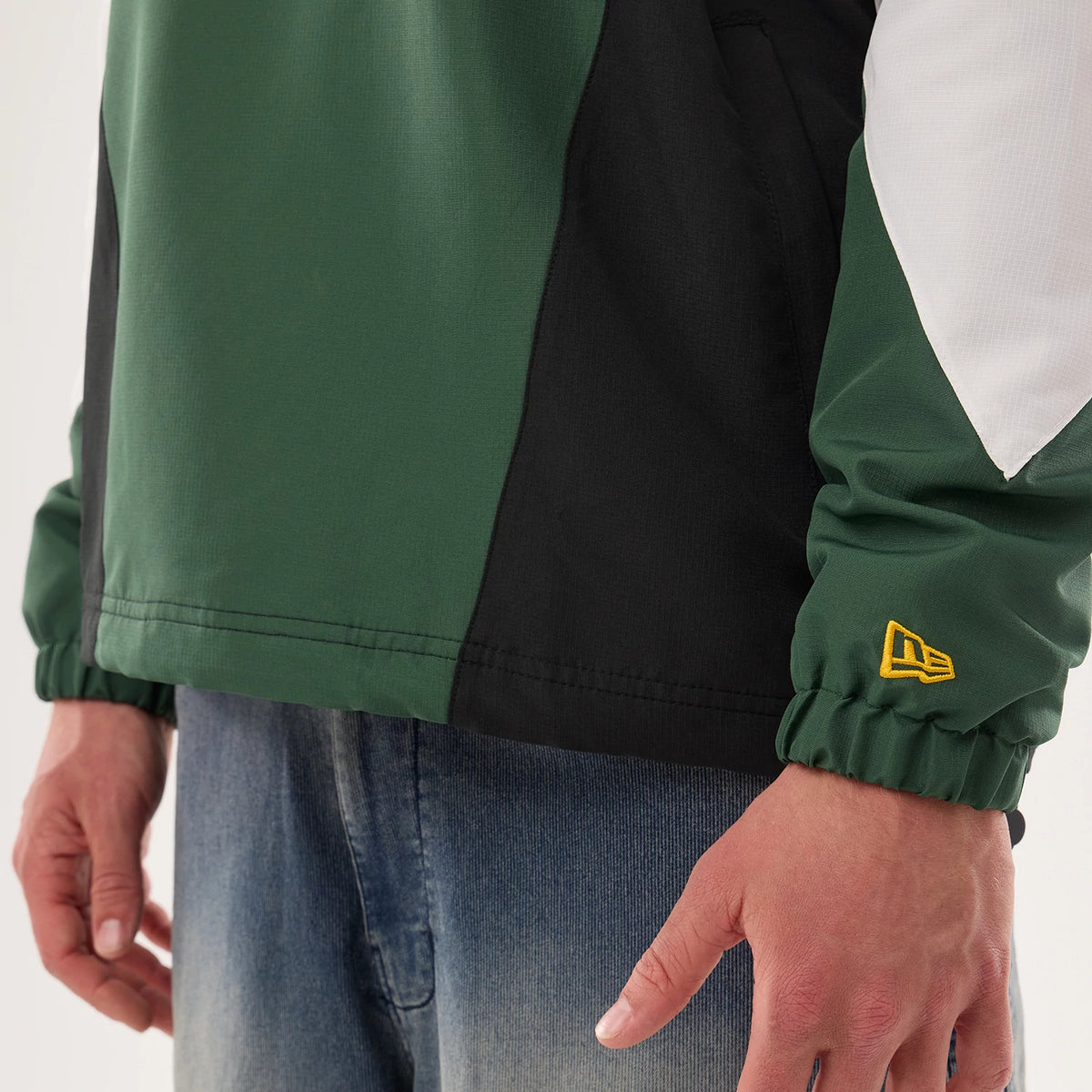 The model is wearing this NFL Green Bay Packers Jacket in dark green. 5
