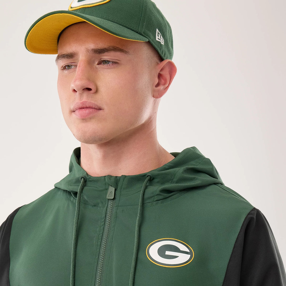 The model is wearing this NFL Green Bay Packers Jacket in dark green. 6