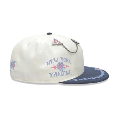 Pictured is this MLB Day Of The Dead New York Yankees 59FIFTY Fitted cap in light beige & dark blue. 5