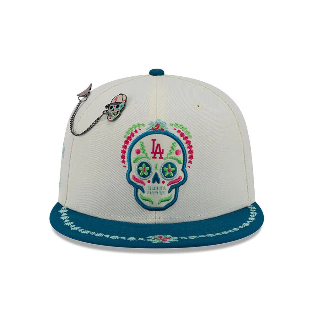Pictured is this MLB Day Of The Dead LA Dodgers 59FIFTY Fitted cap in light beige & blue. 3
