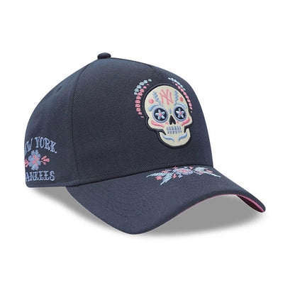 Yankees MLB Day Of The Dead Dark Blue New Era 9FORTY A-Frame Adjustable Cap, three-quarter view showing a large embroidered sugar skull design on the dark blue front panel, floral embroidery on the visor.