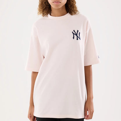 The model is wearing this Womens MLB Graphic New York Yankees T-Shirt in pastel pink. 5