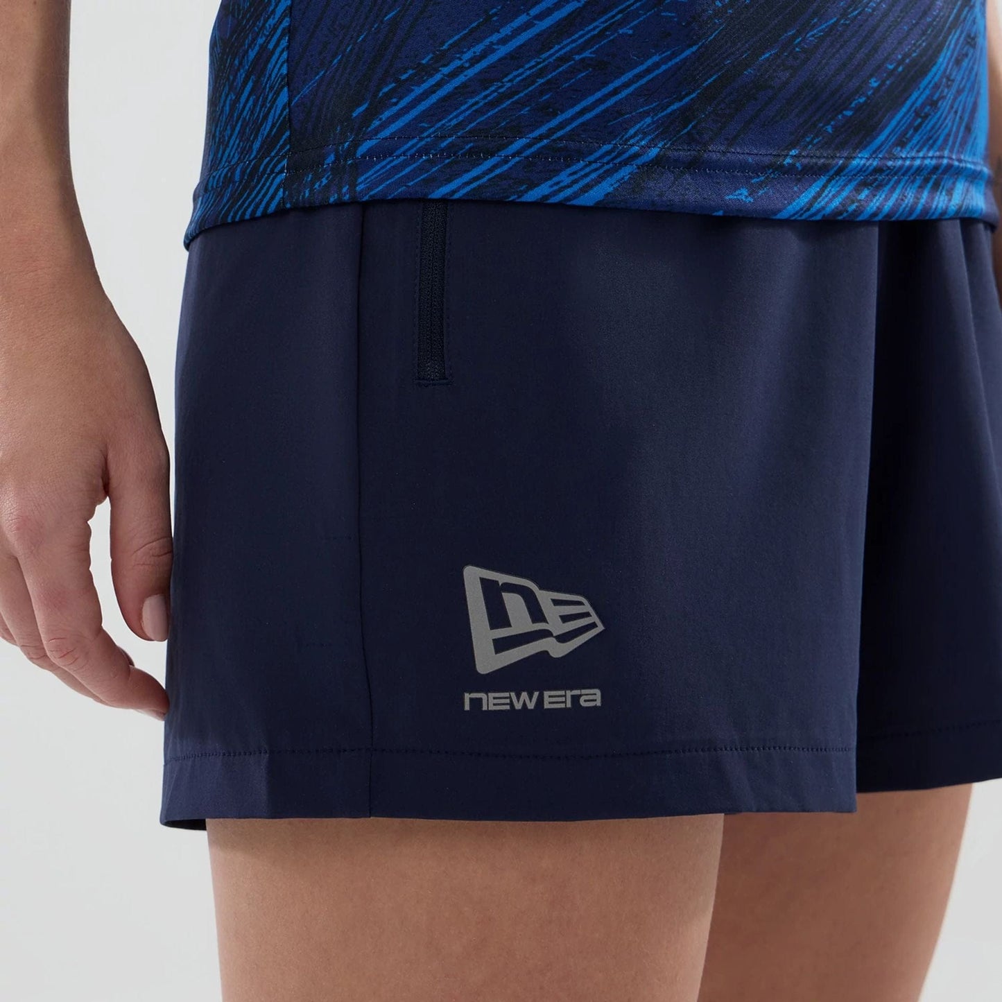 The model is wearing these Womens Atlassian Williams F1 Team Training Shorts in navy. 5