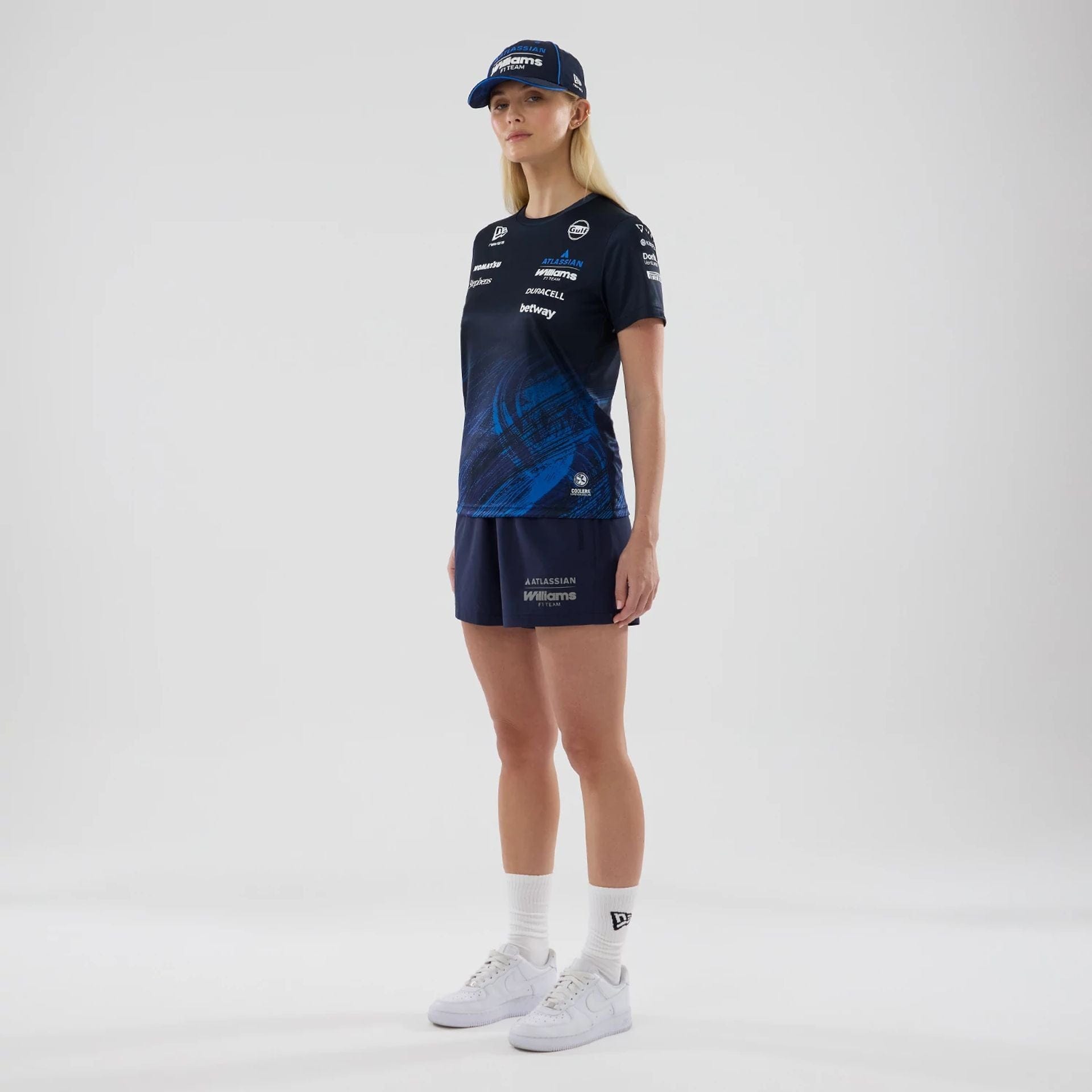 The model is wearing these Womens Atlassian Williams F1 Team Training Shorts in navy. 7