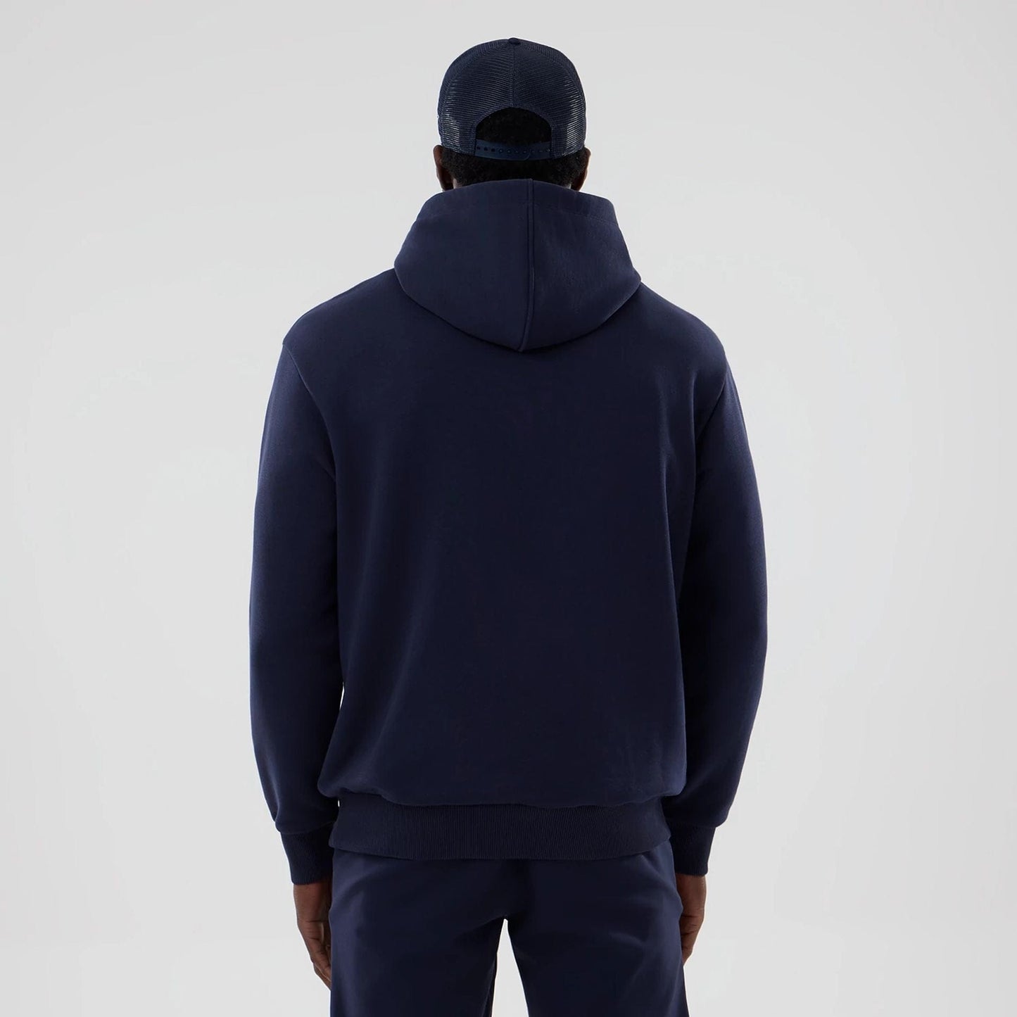 The model is wearing this Atlassian Williams F1 Team Oversized Pullover Hoodie in navy. 2
