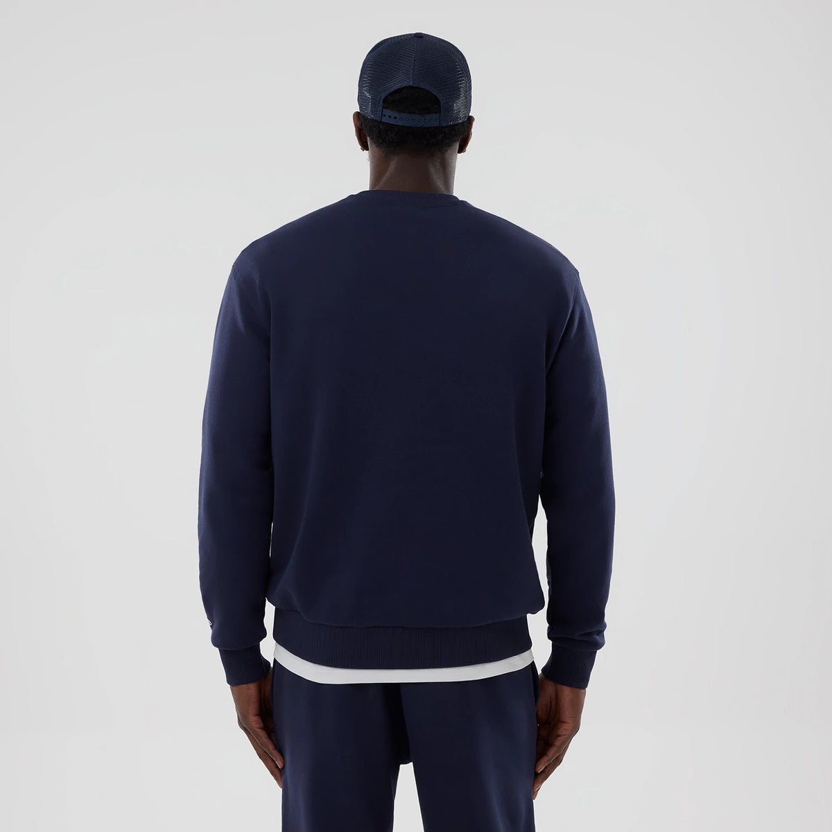 The model is wearing this Atlassian Williams F1 Team Oversized Crew Neck Sweater in navy. 2