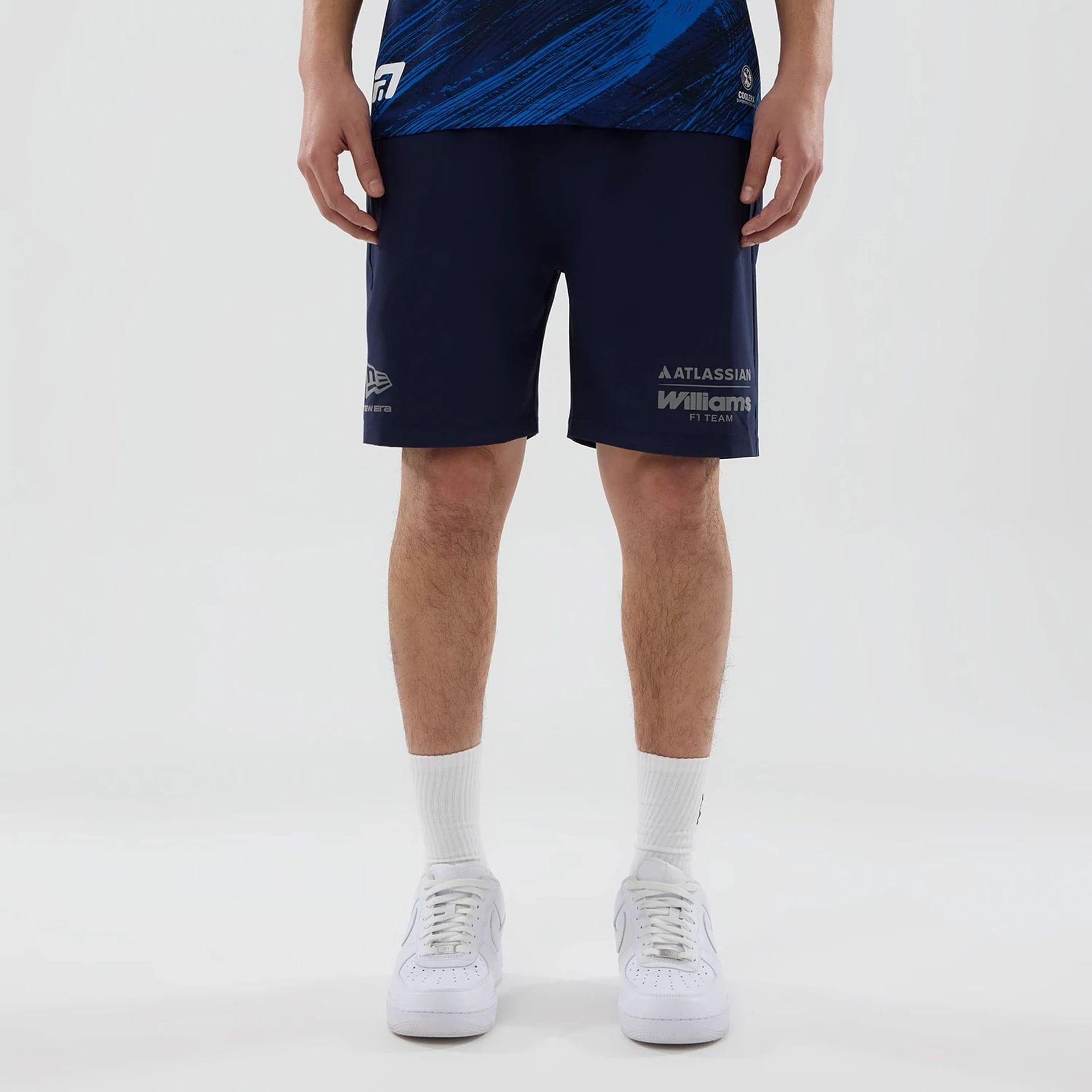 The model is wearing these Atlassian Williams F1 Team Training Shorts in navy. 1