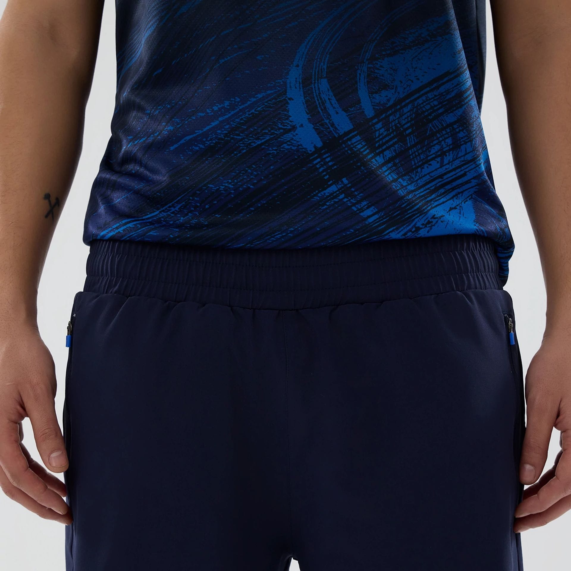 The model is wearing these Atlassian Williams F1 Team Training Shorts in navy. 3