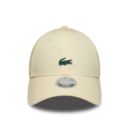 Pictured is this Womens Lacoste X New Era 9FORTY cap in light beige. 2