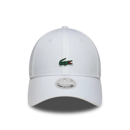 Womens Lacoste X New Era White 9FORTY Adjustable Cap, front view showing the embroidered green and red Lacoste crocodile logo on the white front panel, a curved visor, and a 9FORTY size sticker on the centre of the visor.