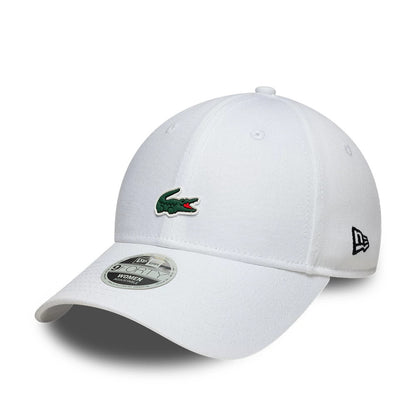 Womens Lacoste X New Era White 9FORTY Adjustable Cap, three-quarter view showing the green and red Lacoste crocodile logo embroidered on the front panel, white curved visor with a 9FORTY size sticker, and New Era flag logo on the left side.