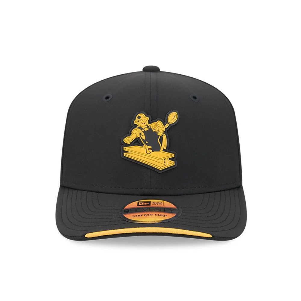 Steelers NFL Sideline 2026 Black New Era 9SEVENTY Stretch Snap Adjustable Cap, front view showing a yellow icon of a worker on the black front panel, with a curved visor featuring a matching yellow edge.
