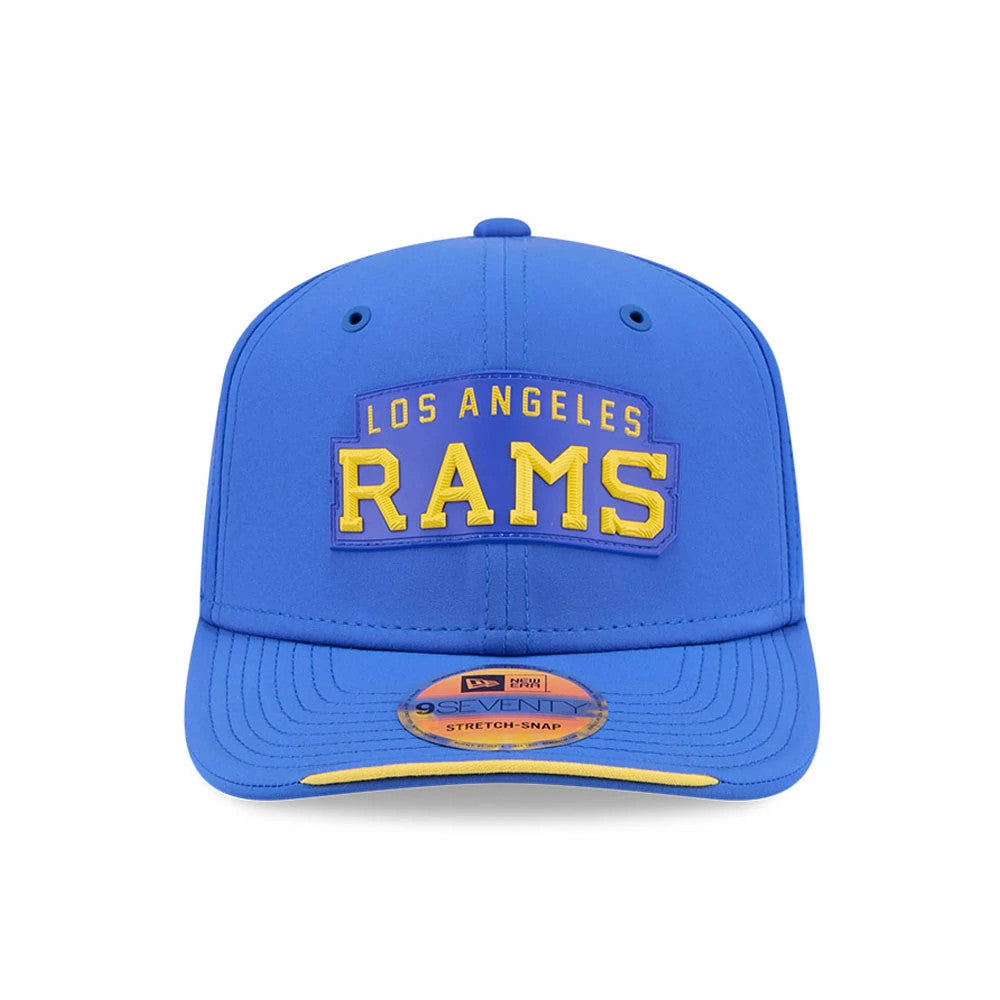 LA Rams NFL Sideline 2026 Blue New Era 9SEVENTY Stretch Snap Adjustable Cap, front view showing the raised yellow embroidered Los Angeles Rams logo on the structured blue crown, with a matching blue visor and official 9SEVENTY size sticker.