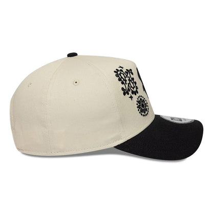 Chicago White Sox MLB Paisley Cream & Black New Era 9FORTY E-Frame Adjustable Cap, side view showing the black New Era flag logo on the left side, intricate black paisley embroidery on the cream front panels, and a curved black visor.