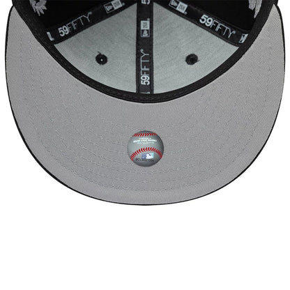 Chicago White Sox MLB Mythical Black New Era 59FIFTY Fitted Cap, inside view showing the grey undervisor with a printed sticker, black sweatband with repeated 59FIFTY branding, and black taping along the seams featuring the New Era logo.