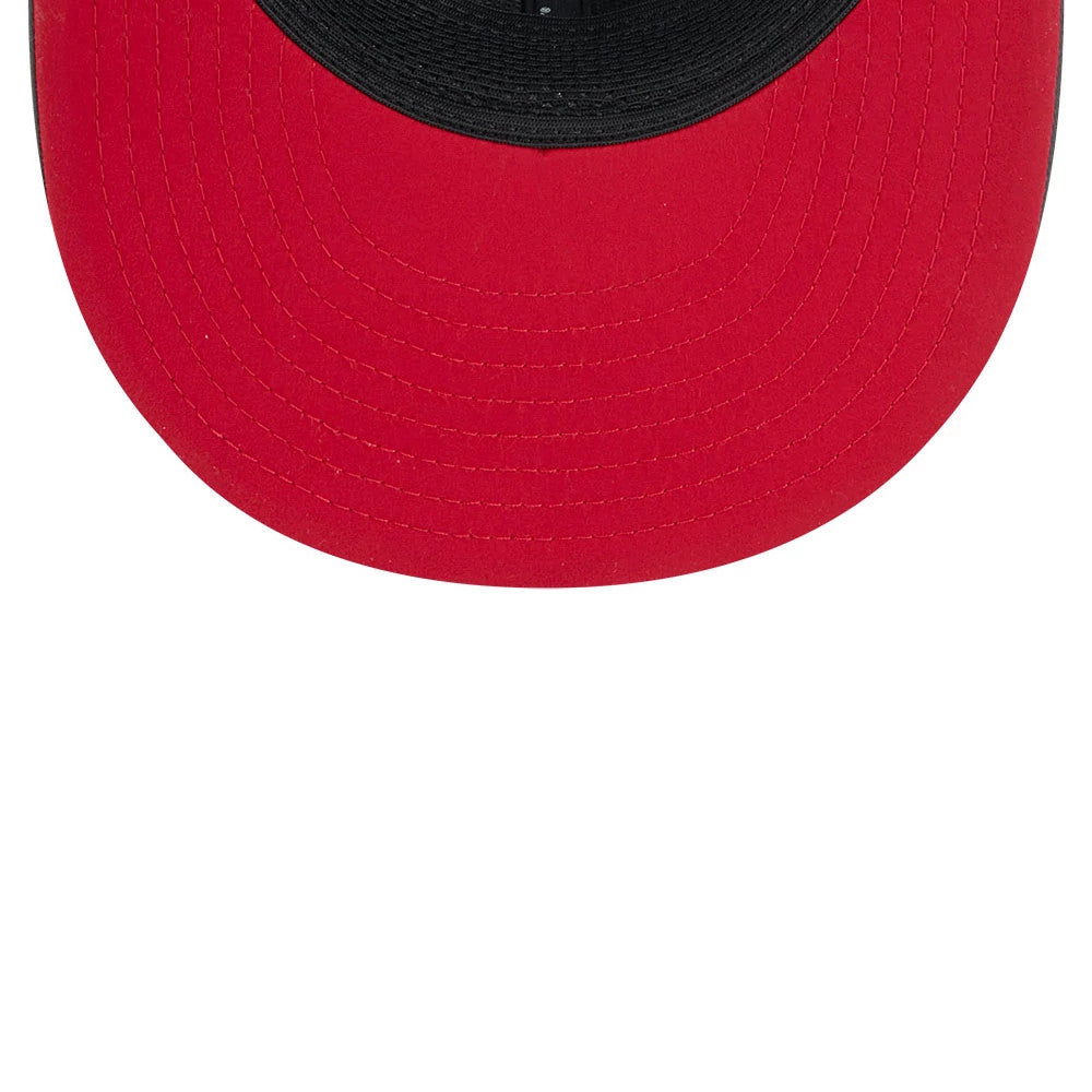 Atlanta Falcons NFL Sideline 2026 Charcoal New Era 9FIFTY Snapback Adjustable Cap, underside view showing the bright red undervisor contrasting with the black sweatband, highlighting the stitching detail around the edge of the curved visor.