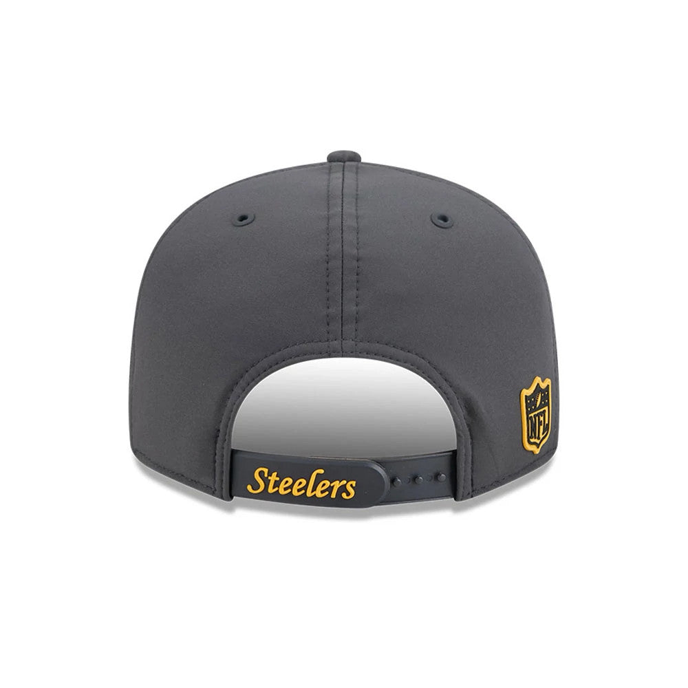 Steelers NFL Sideline 2026 Charcoal New Era 9FIFTY Snapback Adjustable Cap, rear view showing the embroidered Steelers wordmark on the adjustable snap closure, with a black and gold NFL shield logo on the left side of the structured charcoal crown.