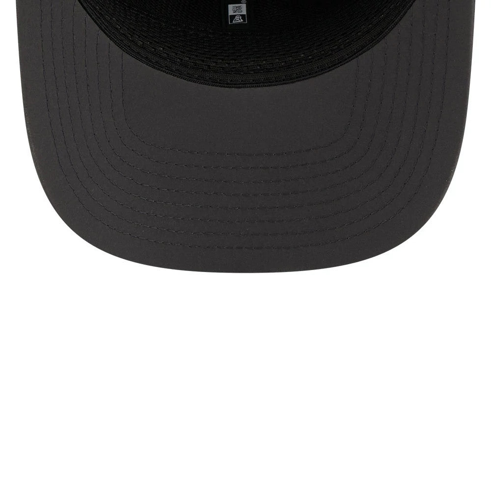 Eagles NFL Sideline 2026 Charcoal New Era 9SEVENTY Stretch Snap Adjustable Cap, inside view showing the black undervisor with concentric circle stitching, interior black taping along the seams, and a printed white size label at the centre.