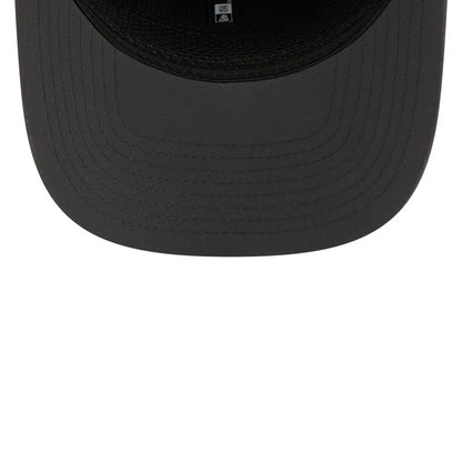 Eagles NFL Sideline 2026 Charcoal New Era 9SEVENTY Stretch Snap Adjustable Cap, inside view showing the black undervisor with concentric circle stitching, interior black taping along the seams, and a printed white size label at the centre.