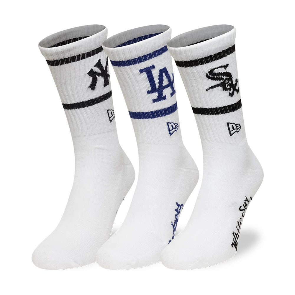 New Era MLB Multi Team White 3 Pack Crew Socks, front view showing three white socks each with a different embroidered team logo: New York Yankees with black stripe, Los Angeles Dodgers with blue stripe.