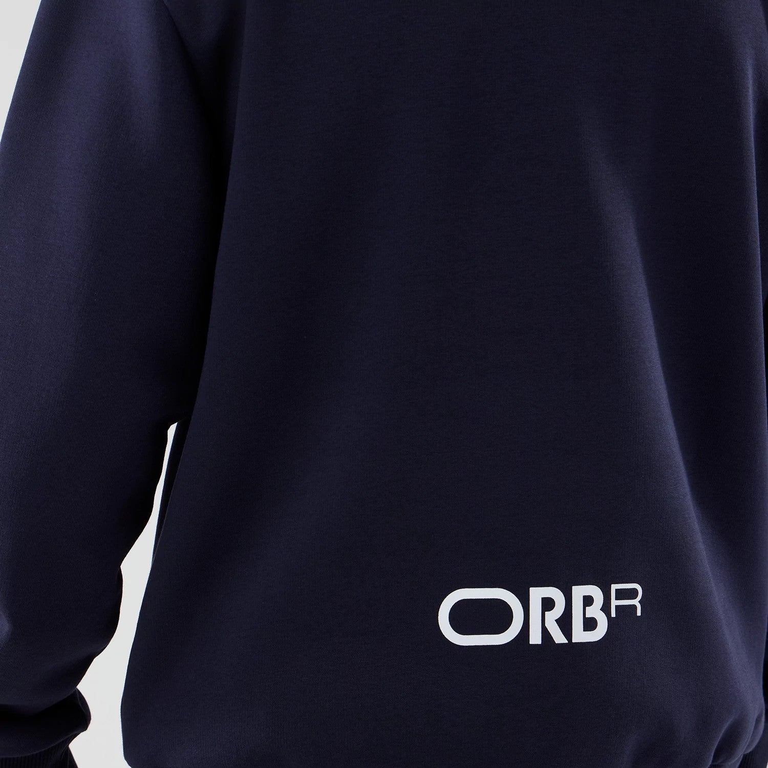 The model is wearing this Red Bull Racing Oversized Crew Neck Sweater in dark blue. 5