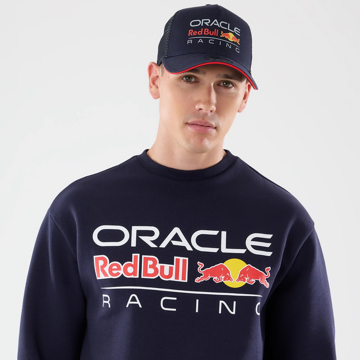 The model is wearing this Red Bull Racing Oversized Crew Neck Sweater in dark blue. 5