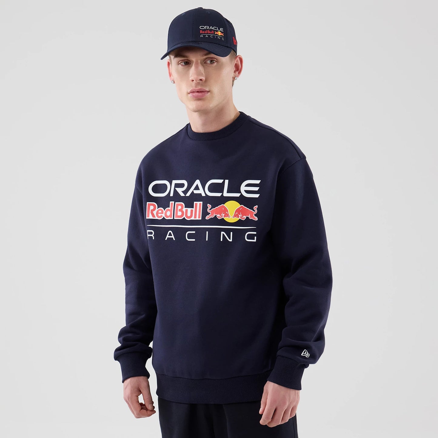 The model is wearing this Red Bull Racing Oversized Crew Neck Sweater in dark blue. 1