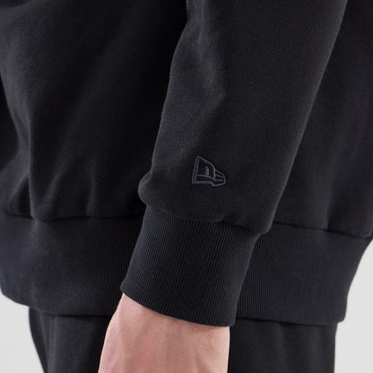 The model is wearing this NBA League Essential Chicago Bulls Oversized Crew Neck Sweater in black. 5