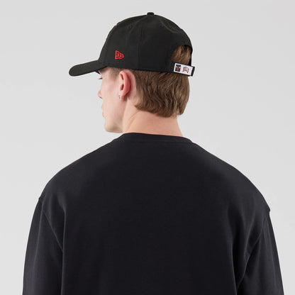 The model is wearing this NBA League Essential Chicago Bulls Oversized Crew Neck Sweater in black. 7