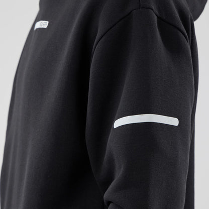 The model is wearing this New Era Tech Oversized Pullover Hoodie in black. 6