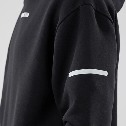 The model is wearing this New Era Tech Oversized Pullover Hoodie in black. 6