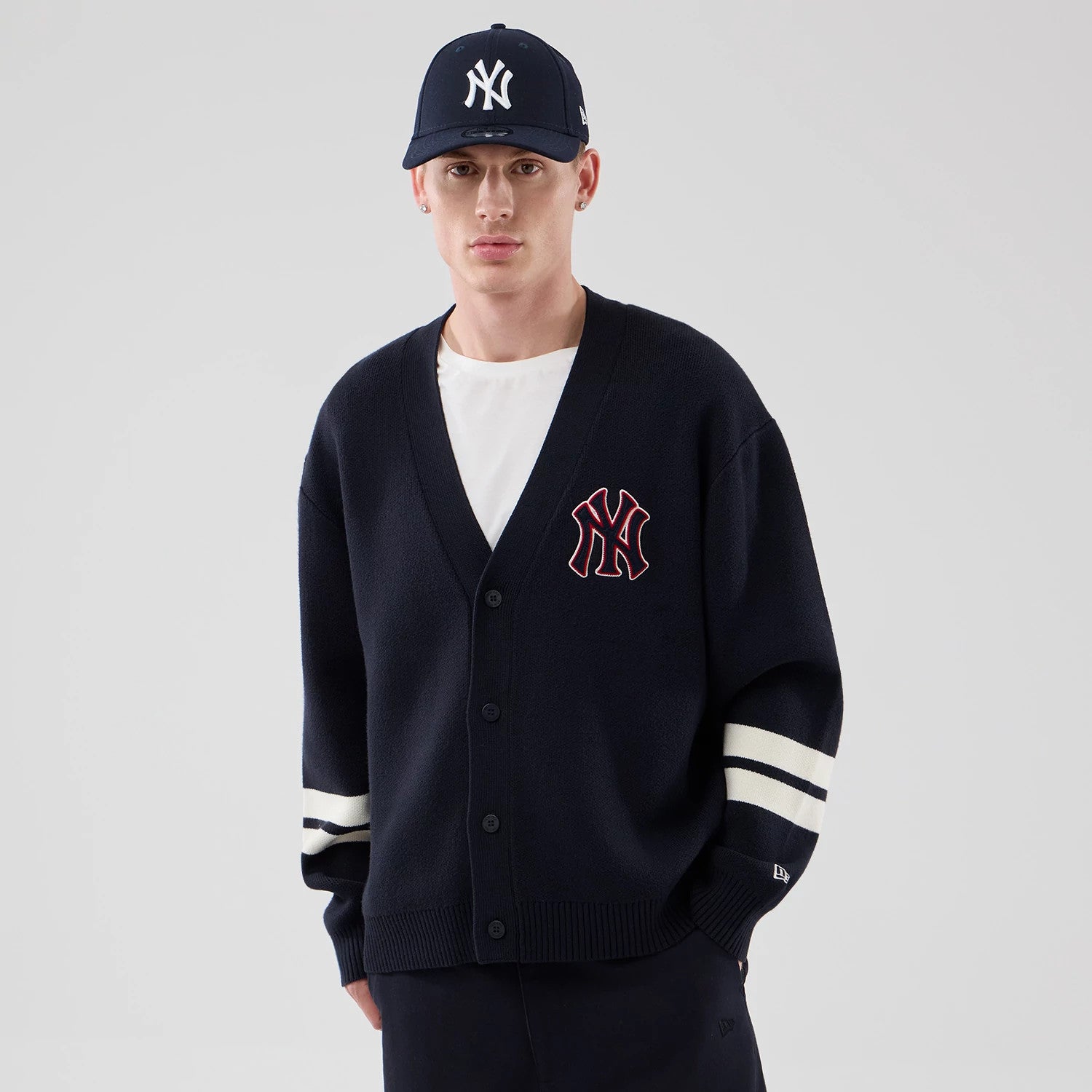 The model is wearing this MLB Knit New York Yankees Cardigan in navy. 1