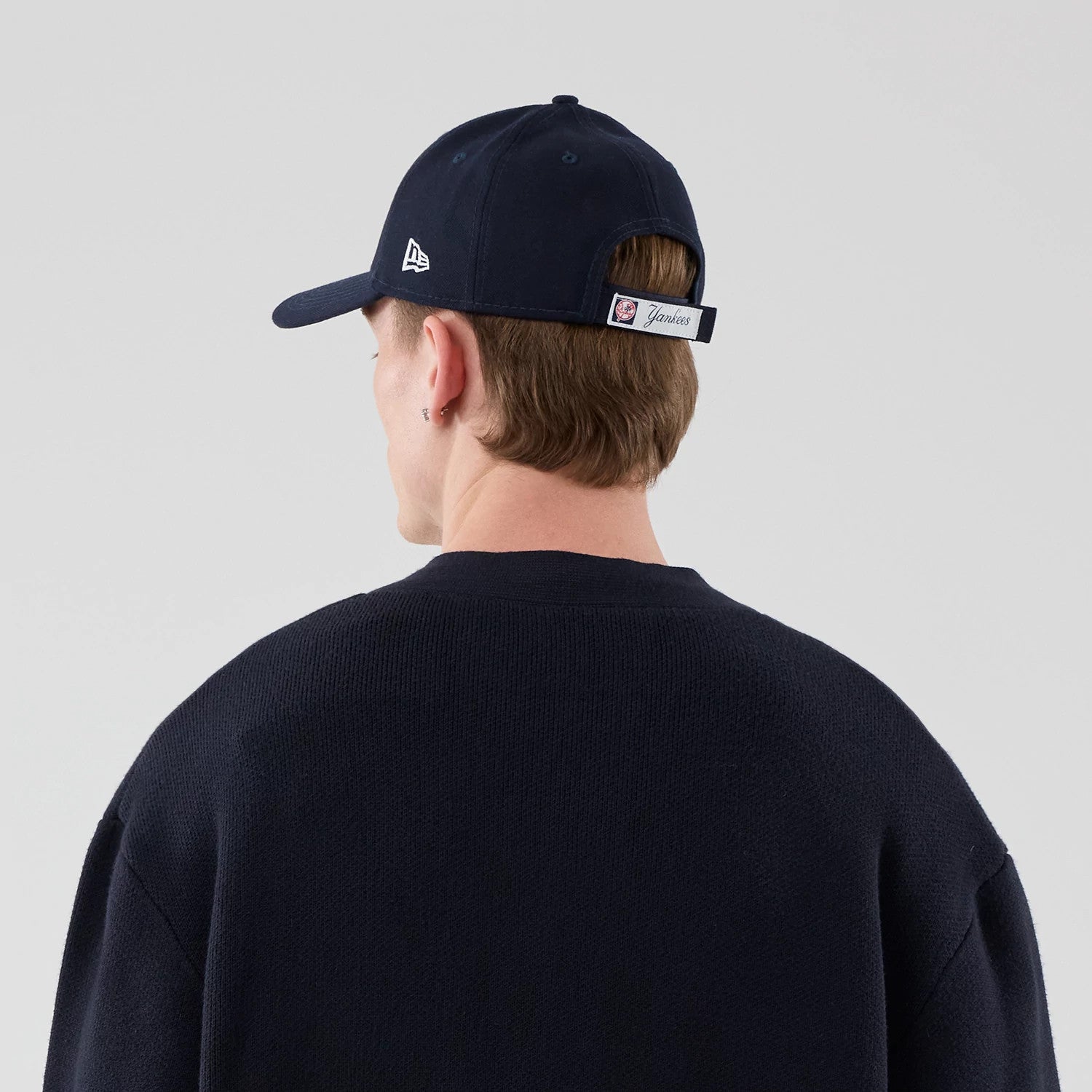 The model is wearing this MLB Knit New York Yankees Cardigan in navy. 7