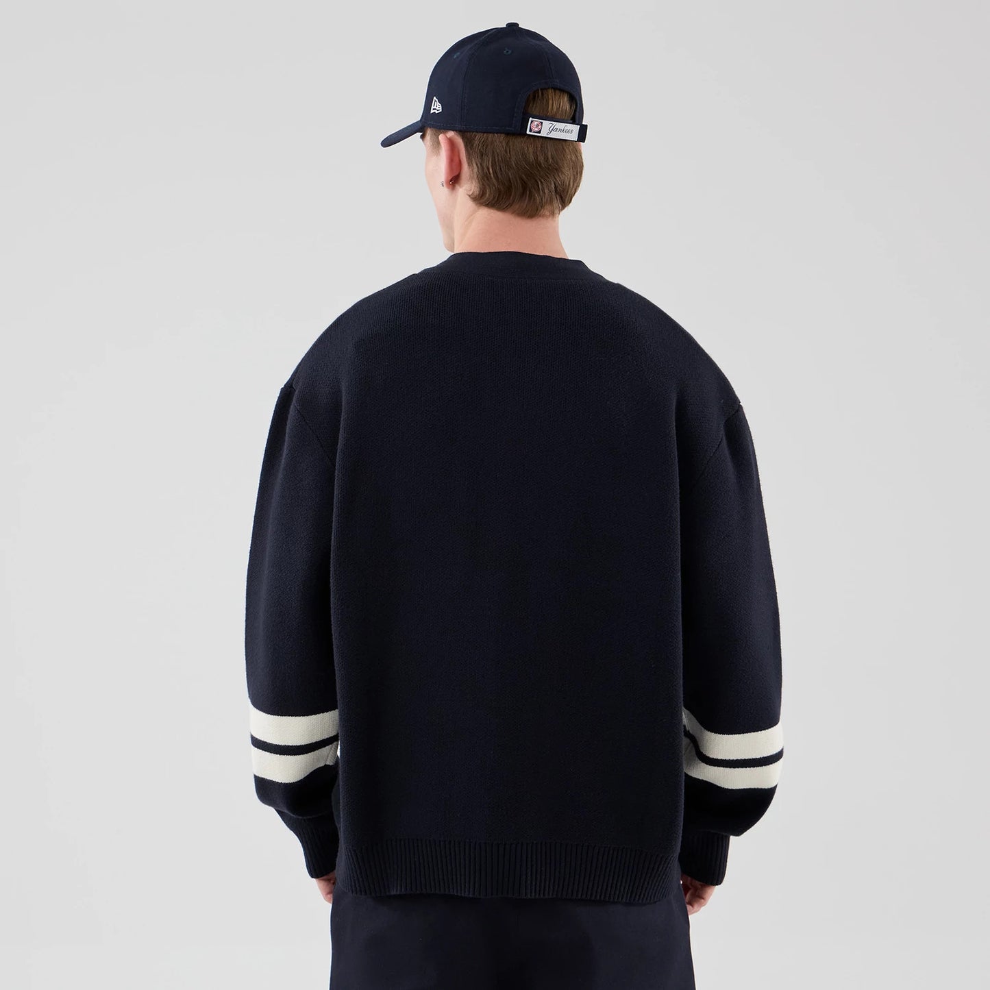 The model is wearing this MLB Knit New York Yankees Cardigan in navy. 2