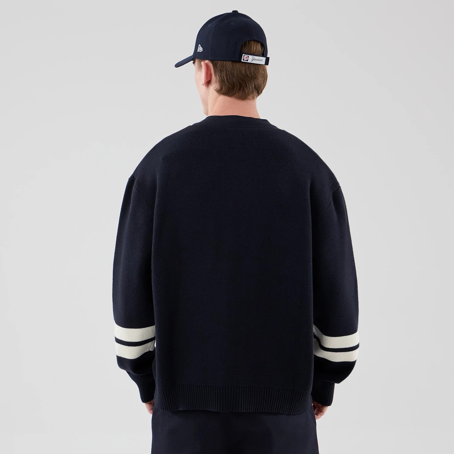 The model is wearing this MLB Knit New York Yankees Cardigan in navy. 2